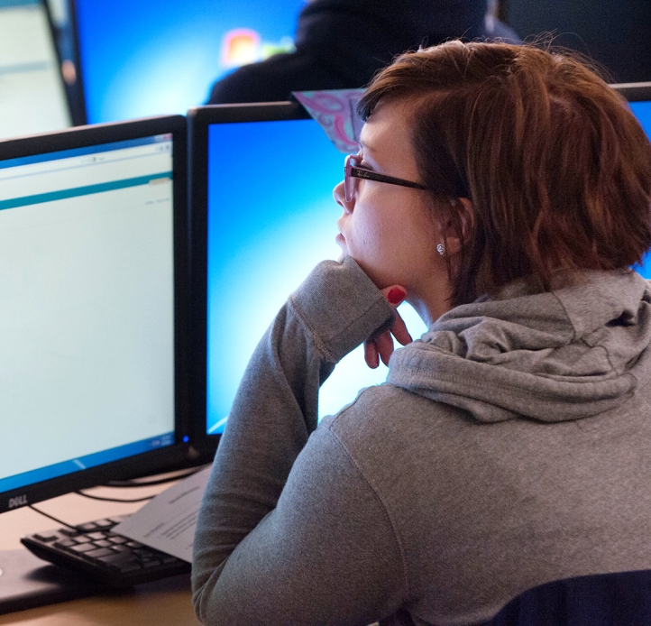 Student working on a monitor in class